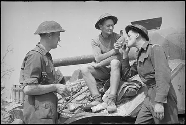 Image: NZ troops relax in ruined castle of Cassino the day it fell, Italy, World War II - Photograph taken by George Kaye