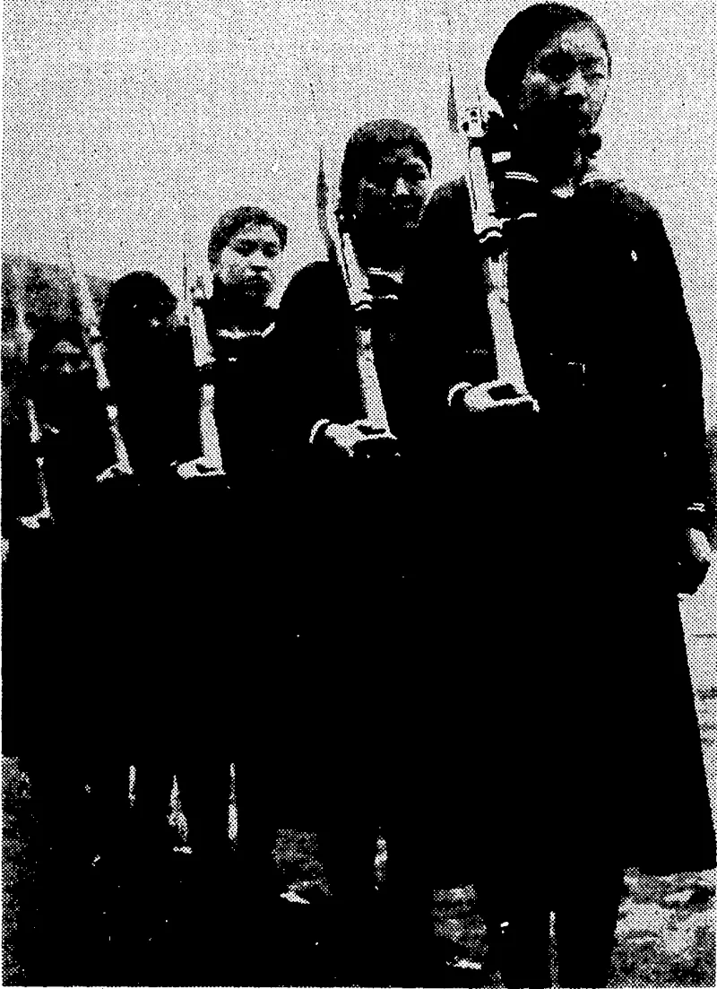 Sport and General" Photo. Japanese girls are being trained in the use of rifles. These girls are pupils of Hinode Girls' High School, at Tokio, and each year they undergo military training. (Evening Post, 25 March 1937)