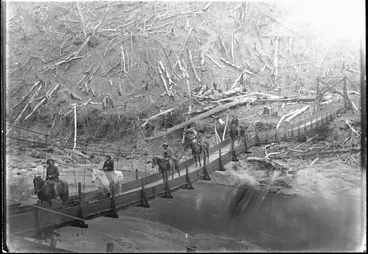 Image: Men riding horses on a swing bridge, Ruangarehu, Waiapu County