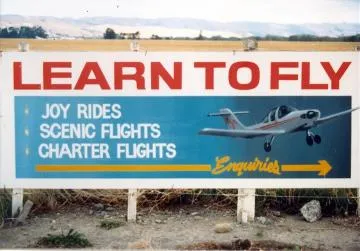 Learn to fly signboard at Hood Aerodrome : digital photograph