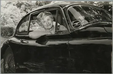 Image: Ngaio Marsh sitting in her Jaguar XK150