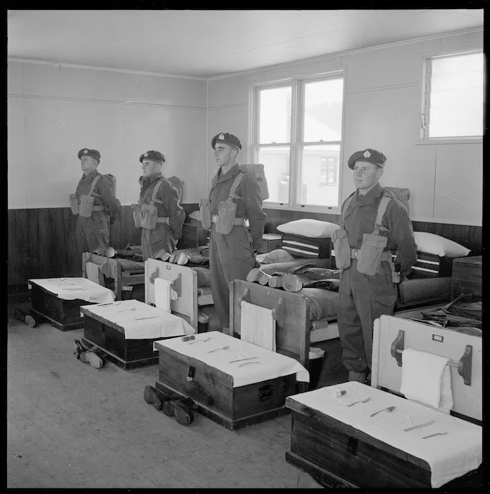 Photograph of four New Zealand Army SAS soldiers lined up for inspection