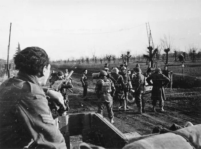 Kaye, George F, 1914- : New Zealand infantry at a cross-road near Faenza