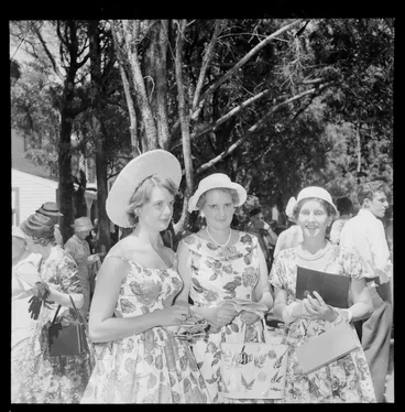 Image: Personalities at the Tauherenikau Racecourse with three unidentified women dressed for the occasion, Wairarapa District