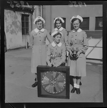 Image: Wellington cadet nursing team of the St John Ambulance Brigade, 1956 New Zealand champions, with trophies and sheild