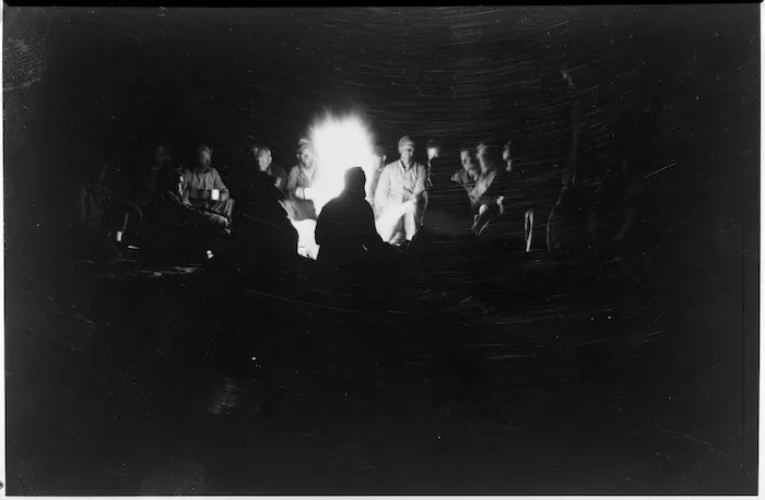 LRDG patrol members sitting around a campfire on the Libyan Sand Sea