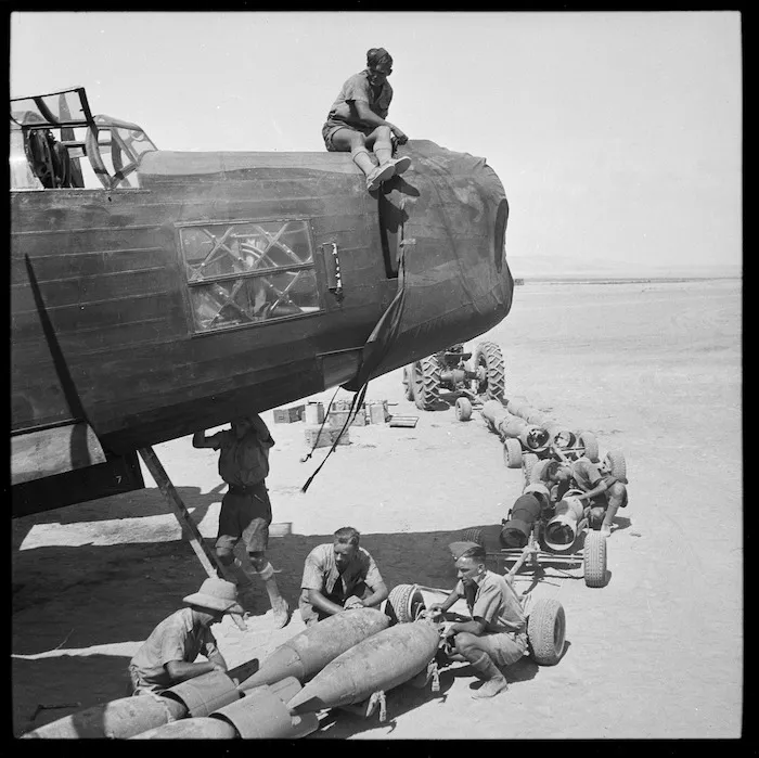 Loading bombs into a Wellington bomber in Egypt during World War 2
