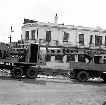 Image: b. Various views of Taranaki Street road works. Includes Traffic Offices directing traffic, the Panama Hotel on the corner of Vivian Street, Wright Stevenson Building, workmen and equipment, and motor vehicle