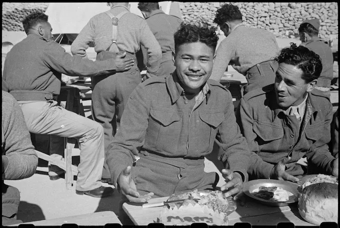 W Ereatara sits down to Christmas Dinner at the Maori Training Depot, Maadi, Egypt - Photograph taken by George Robert Bull