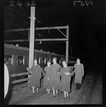 Image: Passengers from a derailed electric train unit in Wellington walking alongside the track