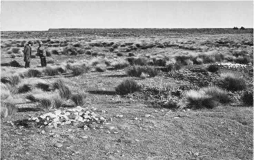 Image: The Northern Margin of the Waitaki Camp Site — The figures in the foreground are Messrs. H. Beattie and D. T. Larnach