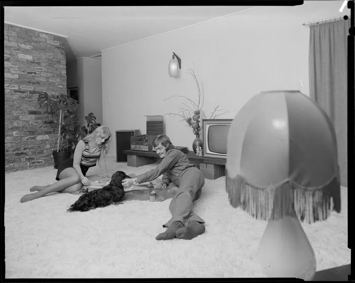 Young people with dog in lounge