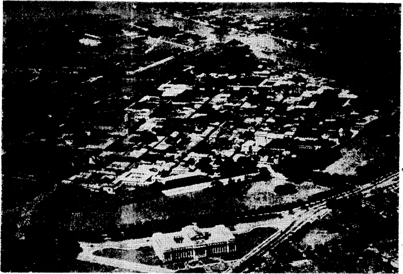 Ah aerial view of Manila, which has been heavily bombed by Japanese aircraft. The old Spanish walled city is in the centre and the more modern Legislative Building is seen in the foreground. (Evening Post, 30 December 1941)