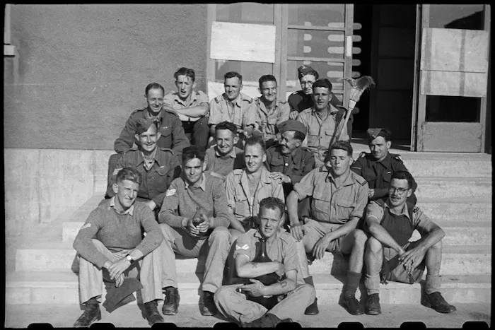 Group of New Zealand front-line troops with staff members of 200 Rest Home in Campobasso, Italy, during World War II - Photograph taken by George Bull