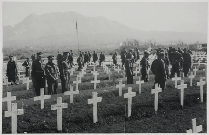 Lieutenant-General Freyberg visiting the graves of New Zealanders at Cassino, after World War 2