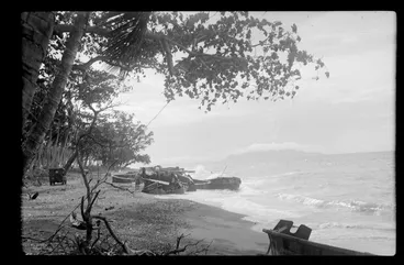 Image: Group of unidentified men sitting in forest area, at RNZAF (Royal New Zealand Air Force) camp, Guadalcanal, Solomon Islands