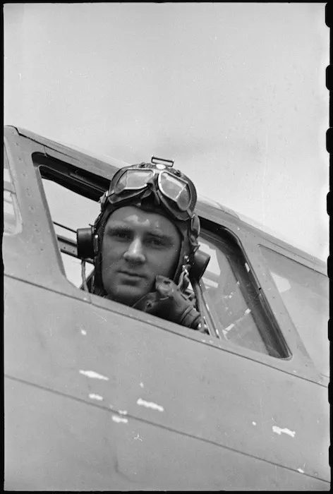 Flight Sergeant C Parkin at the controls of his night bomber on a 'drome' at Caserta, Italy, World War II - Photograph taken by George Bull