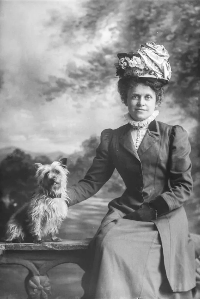 Nurse Holman and dog, 1910