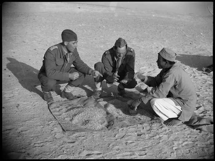 A pedlar bargaining with NZ officers over cost of wares, Egypt