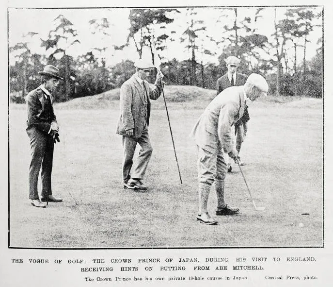 The vogue of golf: the Crown Prince of Japan, during his visit to England, receiving hints on putting from Abe Mitchell