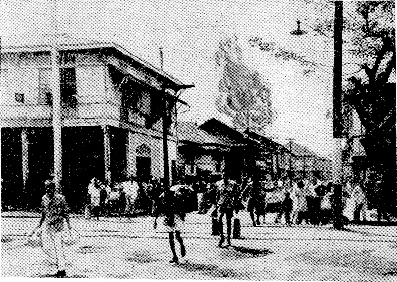 Civilians of Manila rushing to places of safety as the Japanese set off heavy demolition charges to destroy stores and material as they prepared to evacuate the city before the advance of the Americans'. (Evening Post, 24 February 1945)
