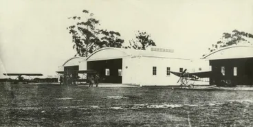 Image: Black and white photograph of the hangars containing Caudron planes at the Canterbury Aviation Company