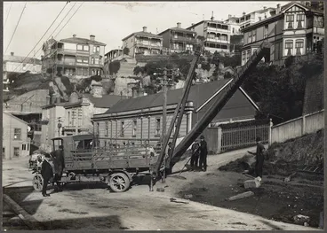 Image: Raising of telephone pole, Boulcott Street, Wellington - Photograph taken by Tibbutt