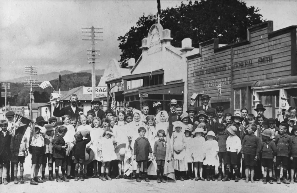 Armistice celebration, Main Street, 1918 (?) A K Jowitt, P E B Burns, Jacob Geange identified.