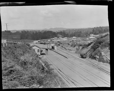 Image: Kakahi Railway Station, rail yard and bridge, sawmill and residential houses with forest beyond, Kakahi Settlement, Manawatu-Whanganui Region