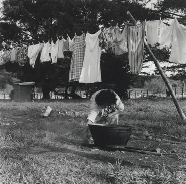 Image: ...watch Mother put some of the washing... From the series: Washday at the pa
