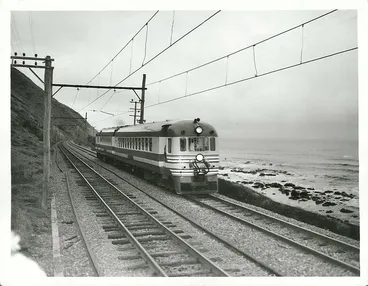 Image: North Island New Zealand Blue Streak Rail Car travelling north between Pukerua Bay and Paekakariki main trunk line to Auckland