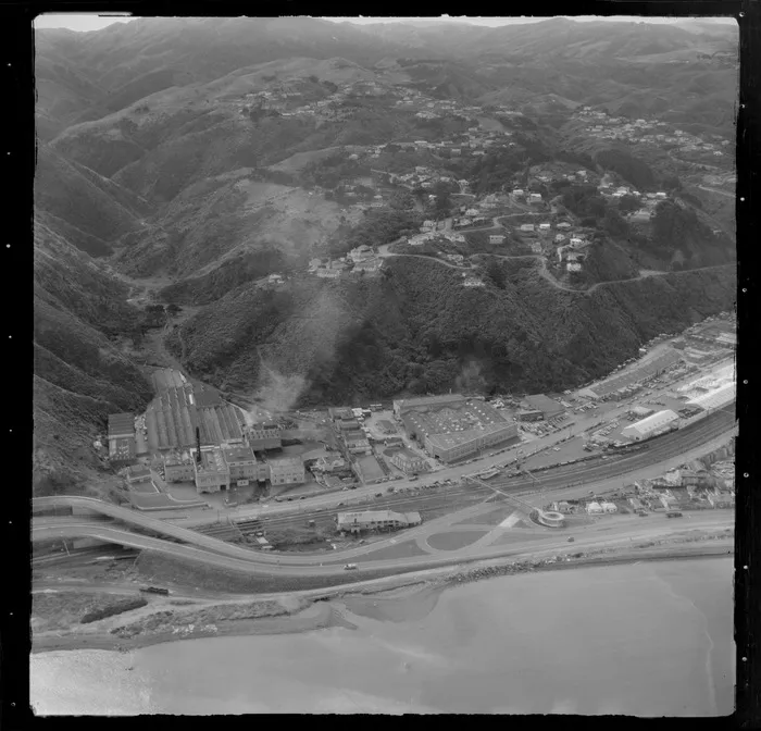 View over the industrial area of the Lower Hutt Valley suburb of Petone with the Western Hutt Road, Petone Railway Station and Wellington Harbour in foreground