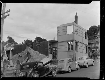 Image: A house being demolished on The Terrace, Wellington City, including parked cars