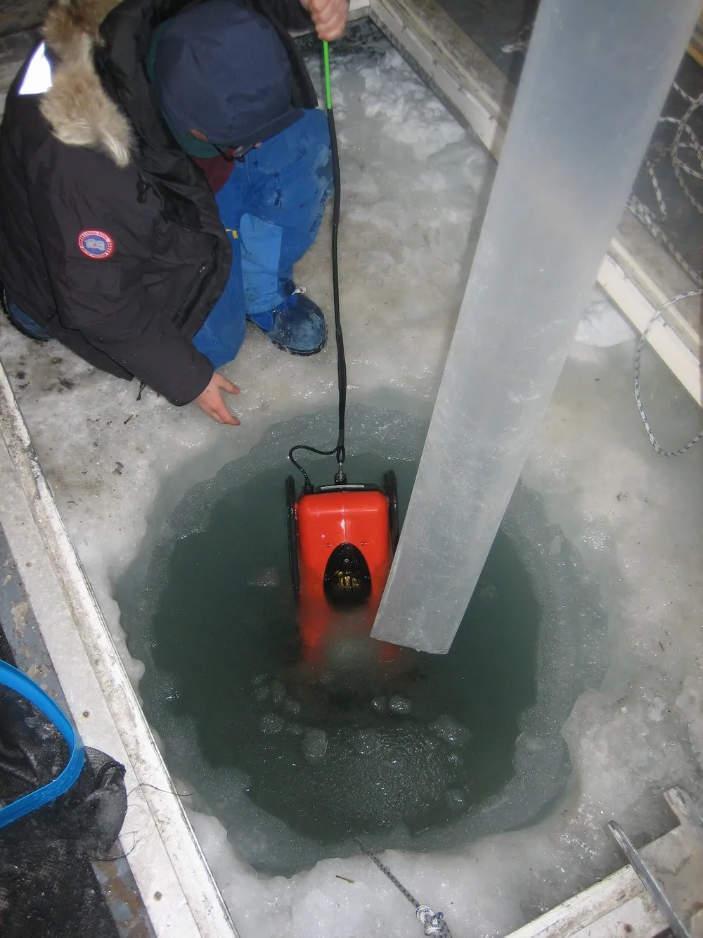 Deploying the ROV through the dive hole at Cape Evans in October 2007