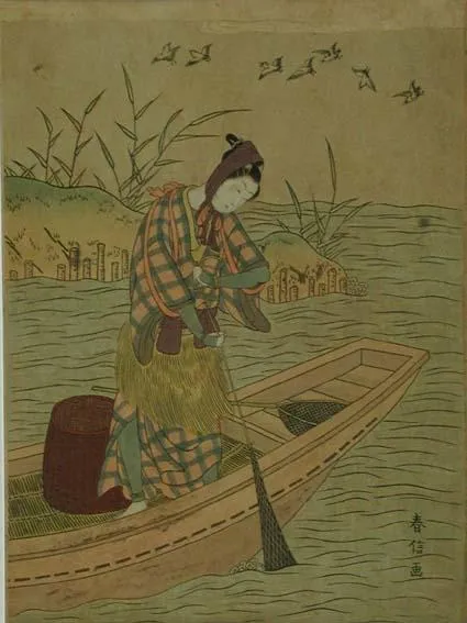 Woman in a boat hauling in a net