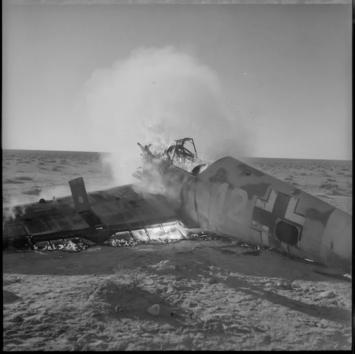 Burning German plane on the ground during 2nd Libyan Campaign, World War II