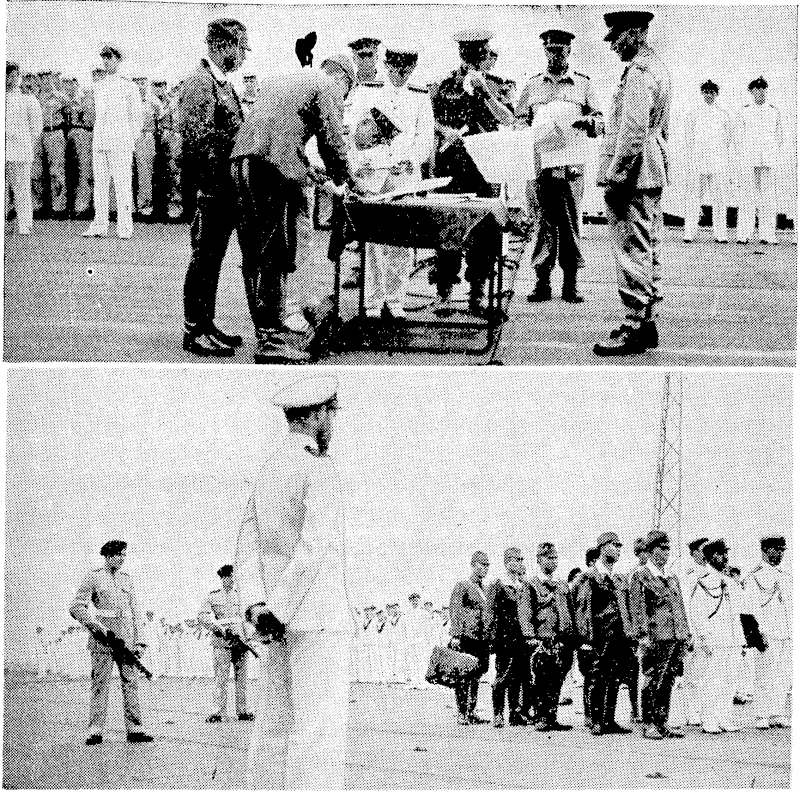 Signing the surrender of the Japanese South-east Army. At top, Admiral Jin-Ichi Kusaka, commander of the Japanese fleet in the area, brushing his signature to the document aboard H.M. aircraft-carrier Glory. Lieut.-General V. A. 11. Sturdee, Commander of the Australian Ist Army, is standing on the right of the table. New Zealand was represented^ by Air Commodore G. N. Roberts. In the lower picture the officer of the watch (with back to camera) keeps an eye on the Japanese party on the flight deck of the carrier, while armed guards stand ready. (Evening Post, 13 September 1945)
