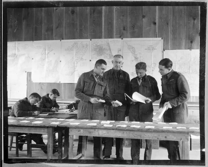 NZEF in Japan Chofu - Polling officers discuss various points before starting the official count of soldiers votes in Japan.