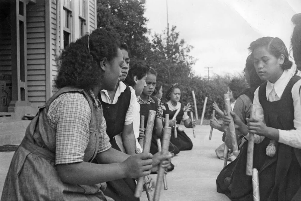 Girls playing stick game