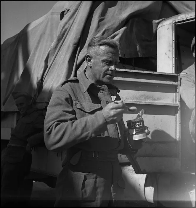 Soldier W Swiney has a meal in the Sirte area, Libya, just before Christmas