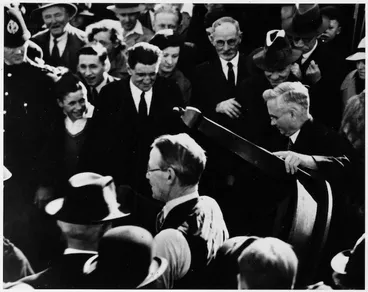 Image: Michael Joseph Savage carrying furniture into the first state house, Miramar