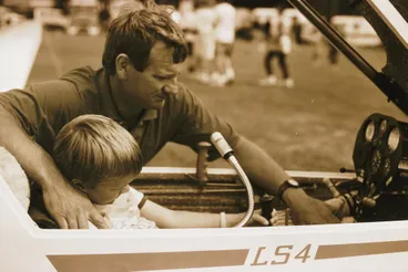 Image: Gliding Club; Tony van Dyk showing son Jason, 5, controls of an LS4 glider.