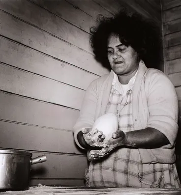 Image: When it is mixed evenly she divides it into four parts, rolling each into a big ball. From the series: Washday at the pa