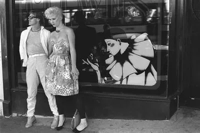 Elegant couple outside Clowns Restaurant, Karangahape Road