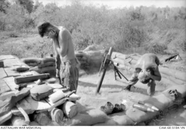 Image: BIEN HOA PROVINCE, SOUTH VIETNAM. 1968-02. BLOCKING THEIR EARS IN THEIR GUN PIT, AS THEY REGISTER A DEFENSIVE FIRE TASK DURING OPERATION COBURG ARE MORTARMEN WITH 2RAR /NZ (ANZAC) (THE ANZAC ..