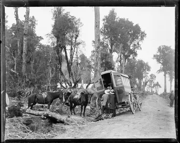 Image: People peering into the back of a draper's van loaded with linens and textiles on the side of a road near the Makatote viaduct, Manawatu Wanganui region