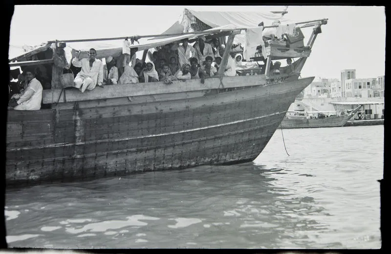 Negative: People on dhow, Dubai, 1967