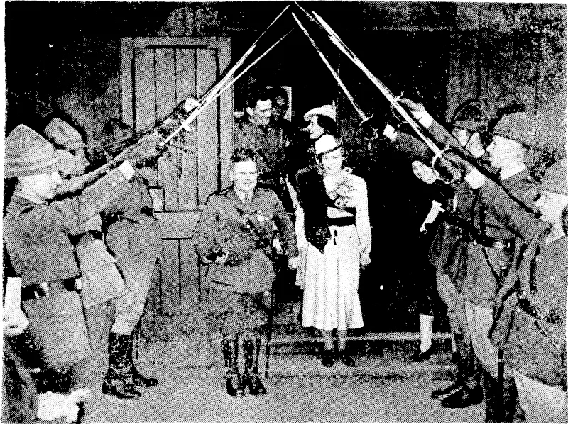 Evening Post" Photo, An archway of swords held by officers .of the Ist Battalion Wellington Regiment (City of Wellington's Own), who provided a guard of honour for Captain and Mrs. A. T. McC. Scott as they left the Cathedral Church of St. Paul after their marriage yesterday afternoon. The bride was formerly Miss Eileen Ano Bennett, daughter of Mr. and Mrs. H. D. Bennett, of Wellington. (Evening Post, 12 September 1939)