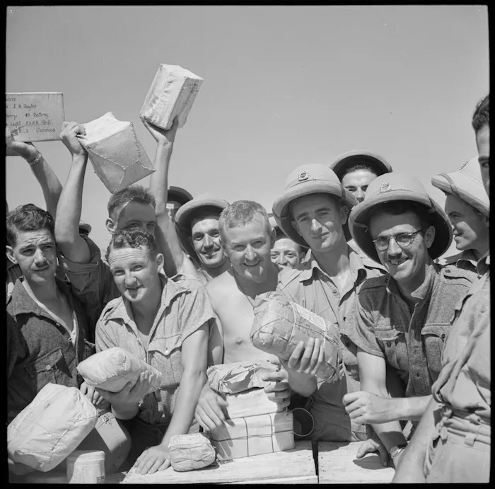 New Zealand soldiers in the Middle East, with parcels from home