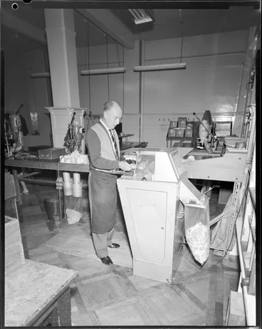 Image: Man operating machinery [Reserve Bank, Wellington?]